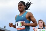 Caster Semenya runs ahead of another woman in a 3,000m race.