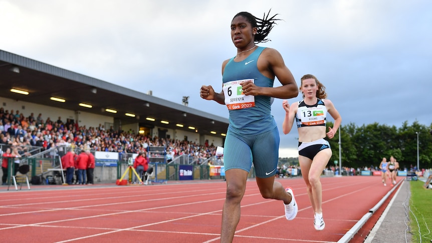 Caster Semenya runs ahead of another woman in a 3,000m race.