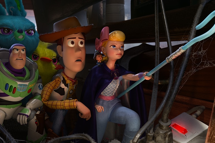 Colour still of Woody, Buzz Lightyear, Duck, Bunny standing behind Bo Peep pointing her blue staff in 2019 film Toy Story 4.
