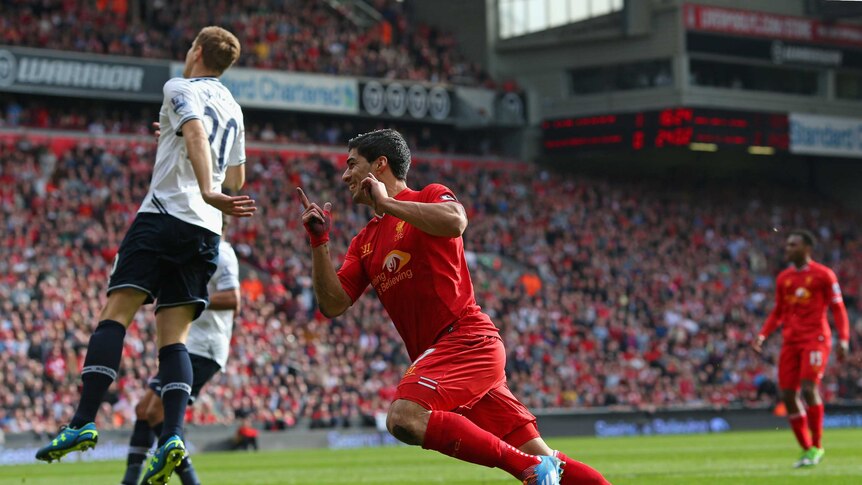 Liverpool's Luis Suarez celebrates scoring against Spurs at Anfield on March 30, 2014.