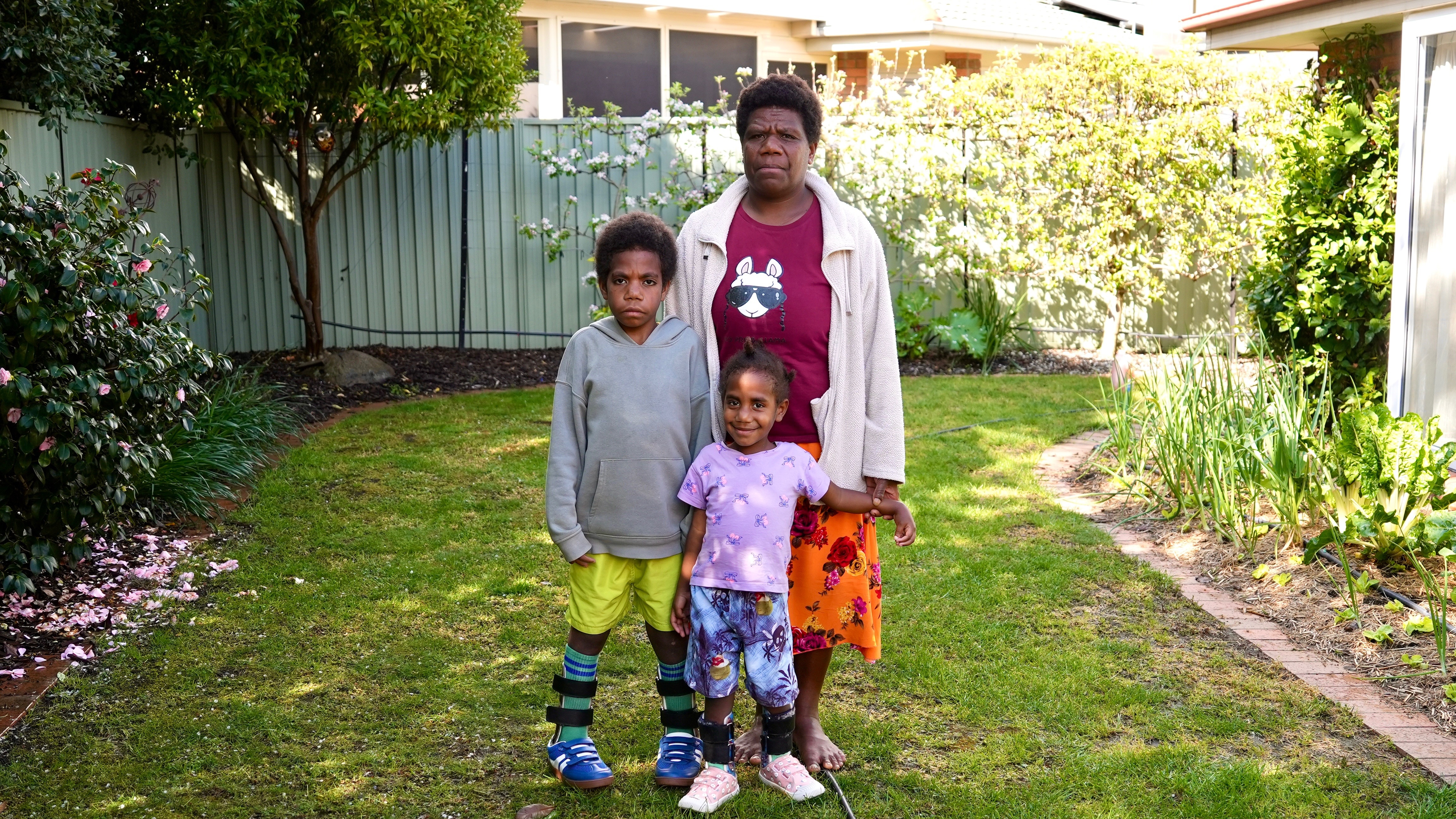 A family from Vanuatu in a Canberra backyard.