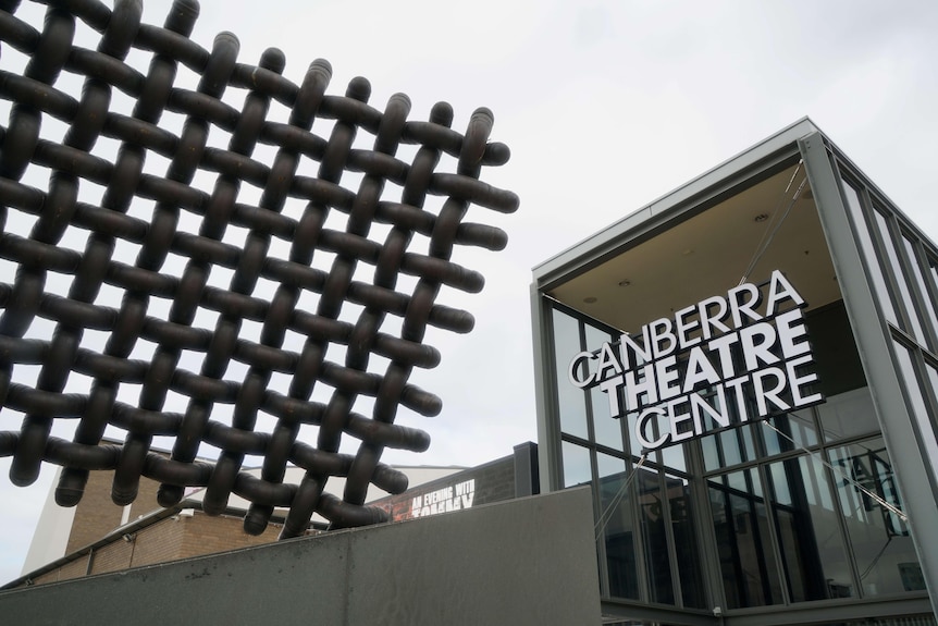 A sign and sculpture outside of the Canberra Theatre Centre.