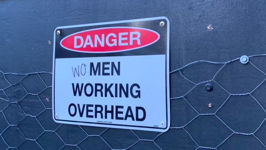 Women working construction sign