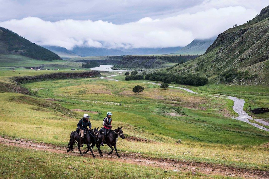 Two riders on horseback in the Mongol Derby