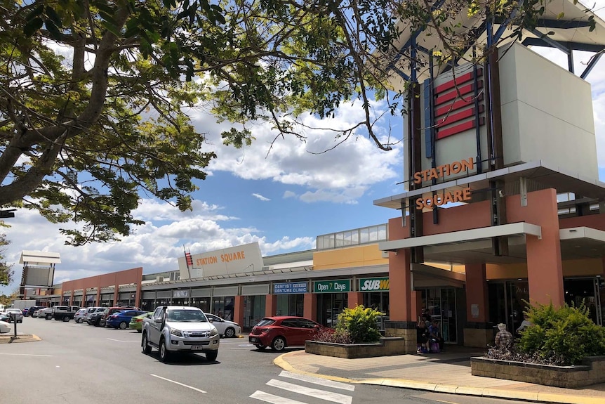 A carpark outside a shopping centre that reads 'station square'.