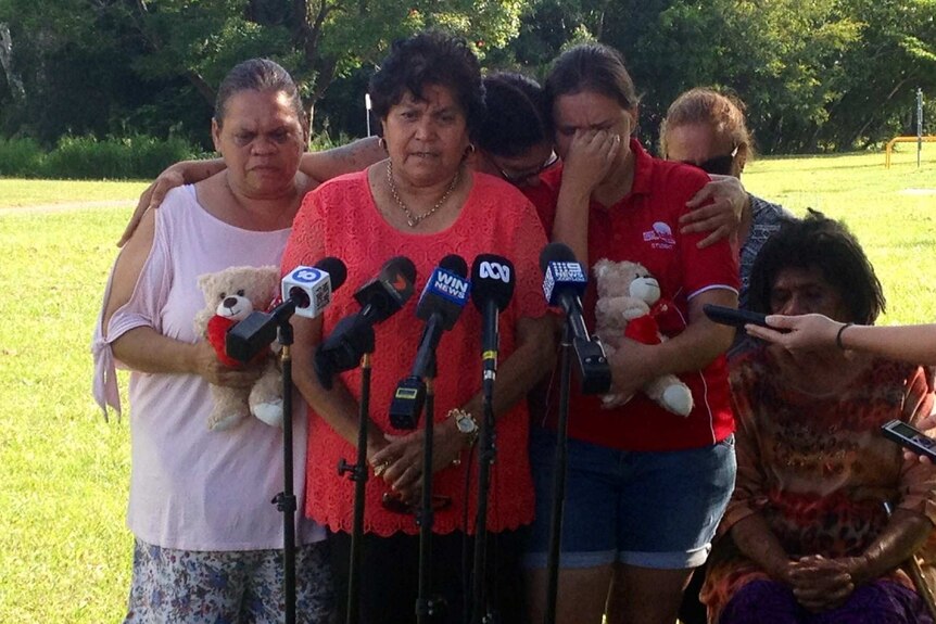 A crying family at a press conference in Townsville.