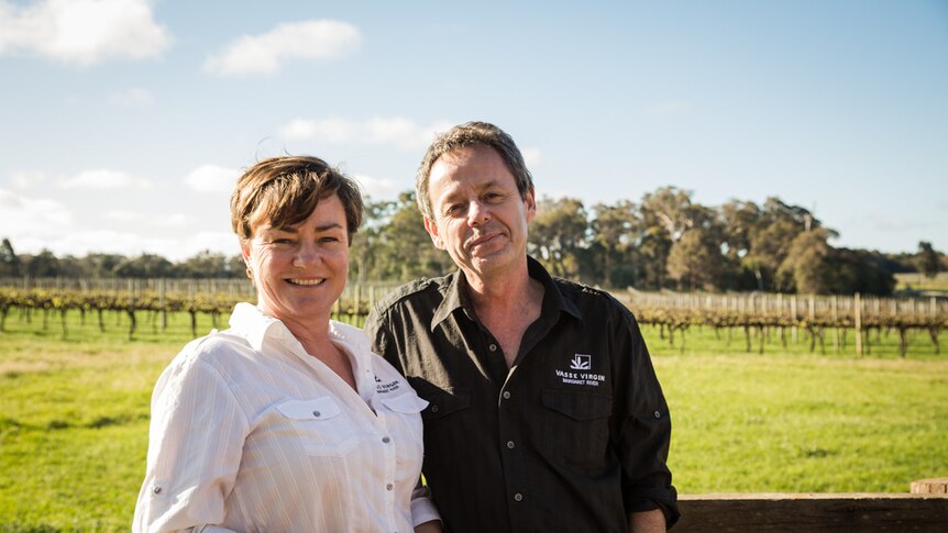 Edwina and Louis Scherini stand in winery