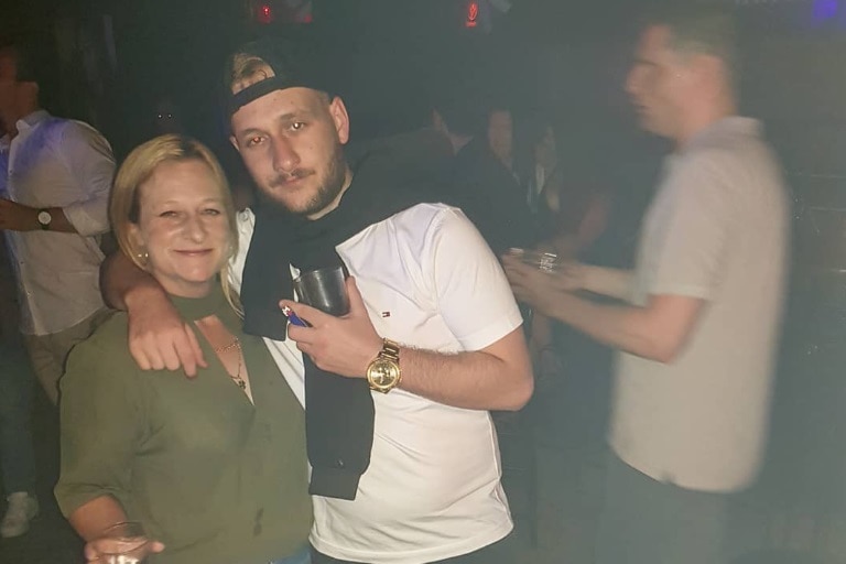 A mother and son celebrate a birthday at an Adelaide entertainment venue.