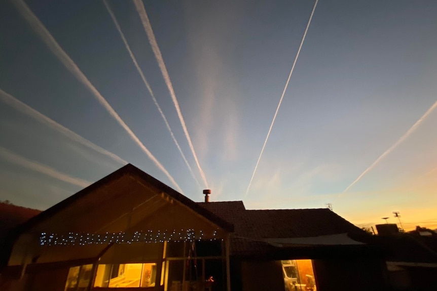 vapour trails over house