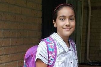 Tiahleigh Palmer dressed in school uniform with a backpack.