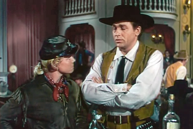 A screenshot shows Doris Day and Howard Keel dressed in cowboy hats and outfits.