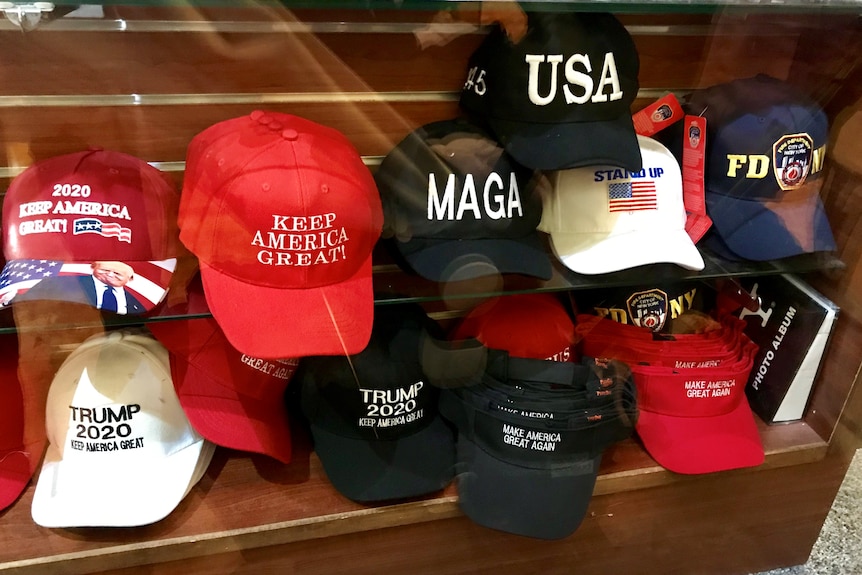 themed hats, including trump hats, on a shelf