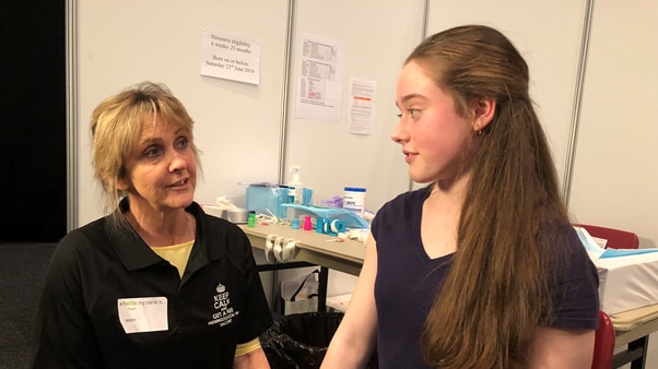 Tara Jones prepares to have a meningococcal vaccination