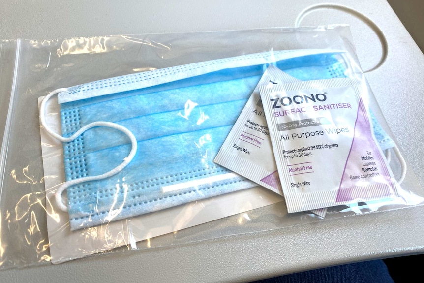 Photo of a complementary face mask and hand wipes.