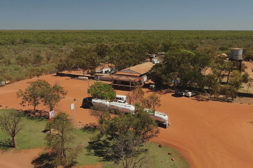 An aerial shot of a roadhouse surrounded by pindan dirt