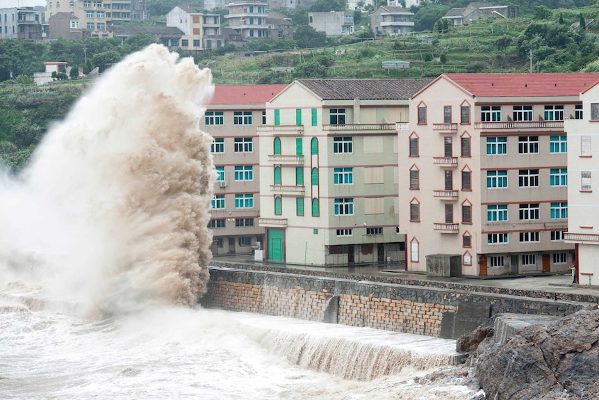 Waves rise over six-storey buildings on the east coast of China's Zhejiang province as Typhoon Chan-hom approaches