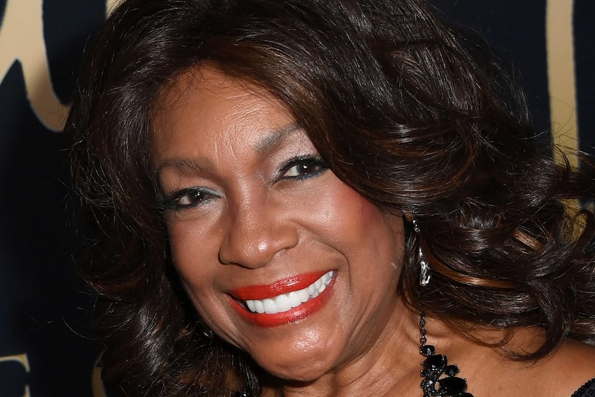 A head shot of a smiling Black woman.