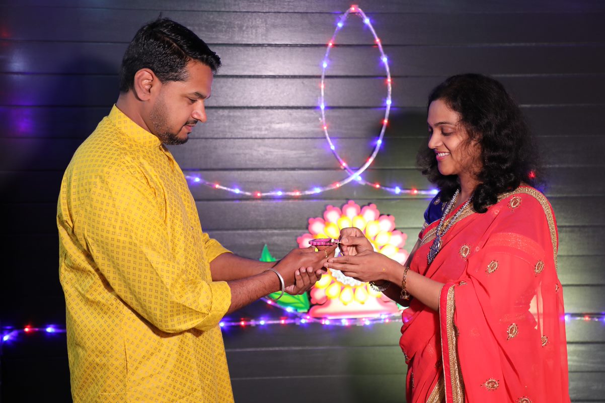 A man and a woman dressed in colourful clothes
