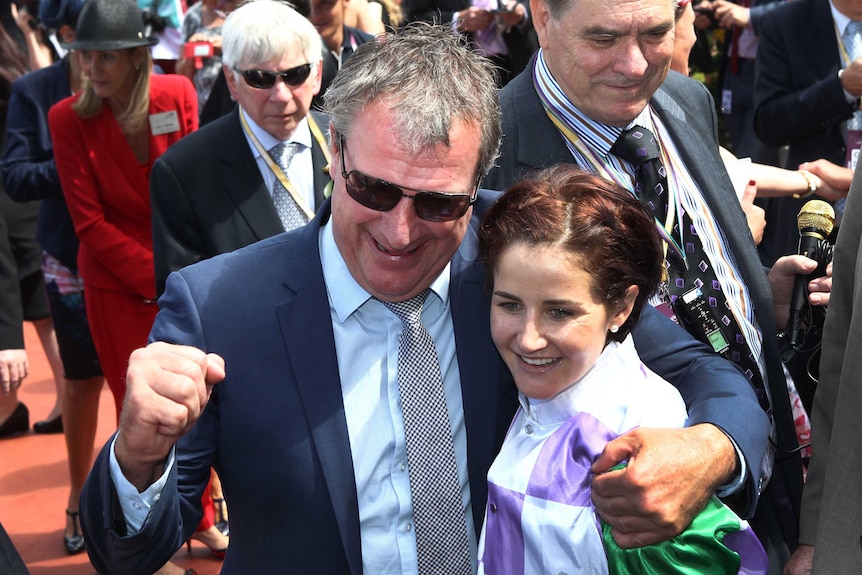 Prince of Penzance trainer Darren Weir and jockey Michelle Payne celebrate after winning the Melbourne Cup.