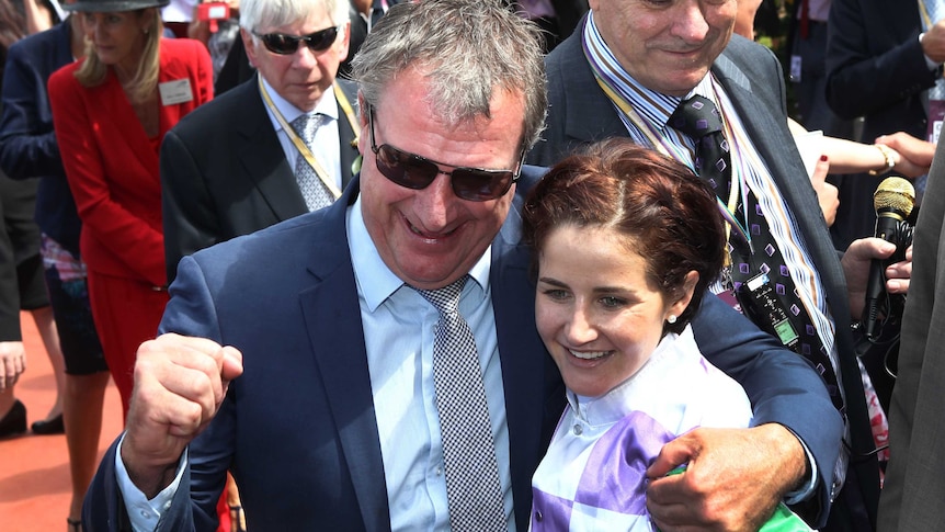 Prince of Penzance trainer Darren Weir and jockey Michelle Payne celebrate their Melbourne Cup win.