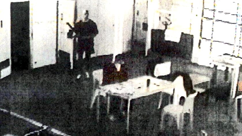 CCTV still of Matthew Johnson about to attack Carl Williams at Barwon Prison in April 2010.