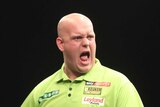 Michael van Gerwen screams with his arms down by his side, hands clenched in fists