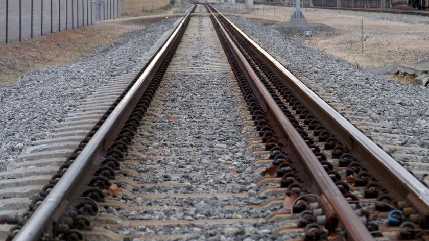 Railway tracks disappear into the distance