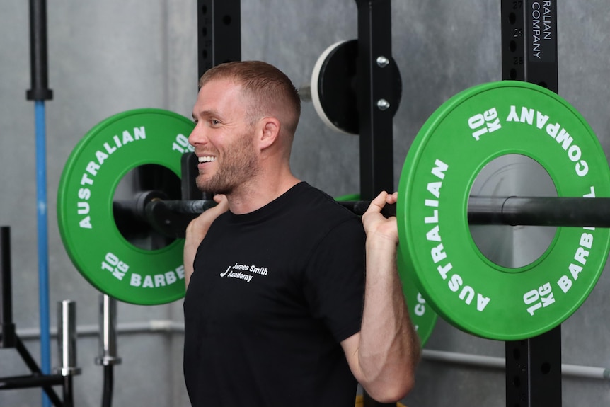 James Smith weightlifting in his gym