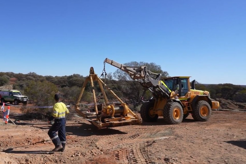 A mine truck brings a winch into a remote area in the WA outback