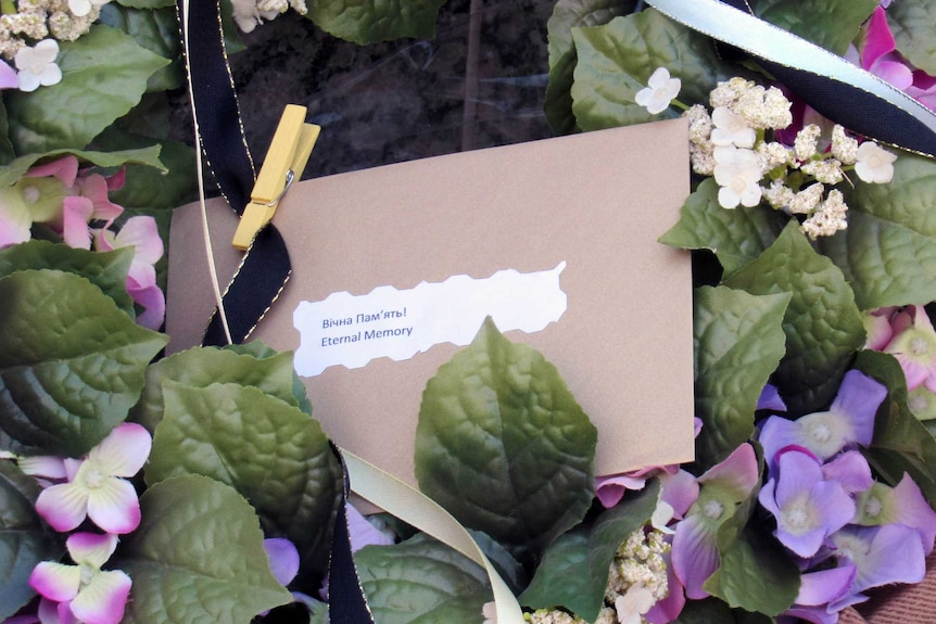 The message on this wreath left outside the Dutch embassy simply said: 'Eternal Memory'.