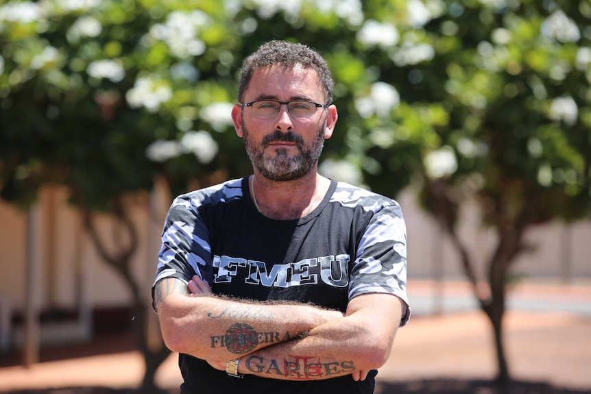 Union rep standing with arms crossed