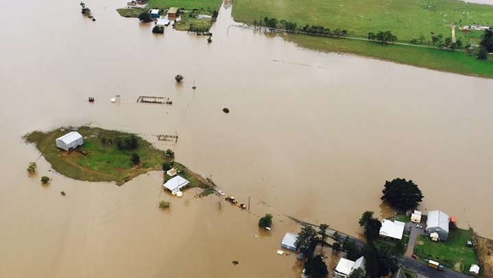 An aerial shot of the town of Dungog surrounded by floodwaters.
