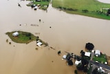 An aerial shot of the town of Dungog surrounded by floodwaters.