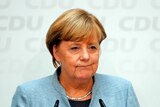 Angela Merkel addresses a news conference.