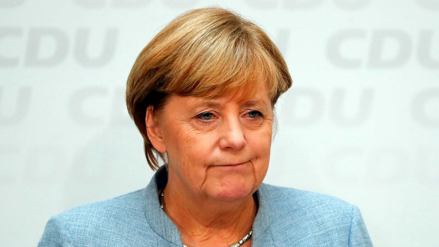 Angela Merkel addresses a news conference.