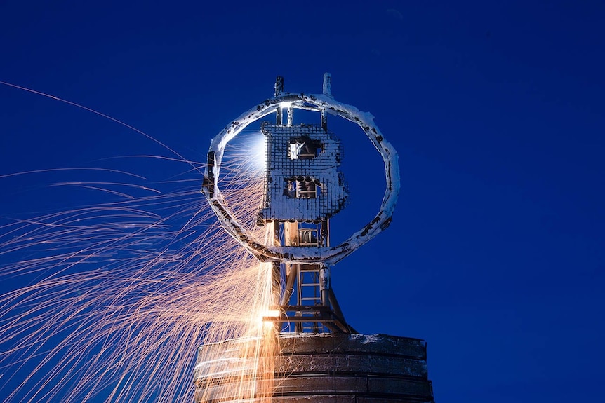 Bitcoin sculpture with sparks