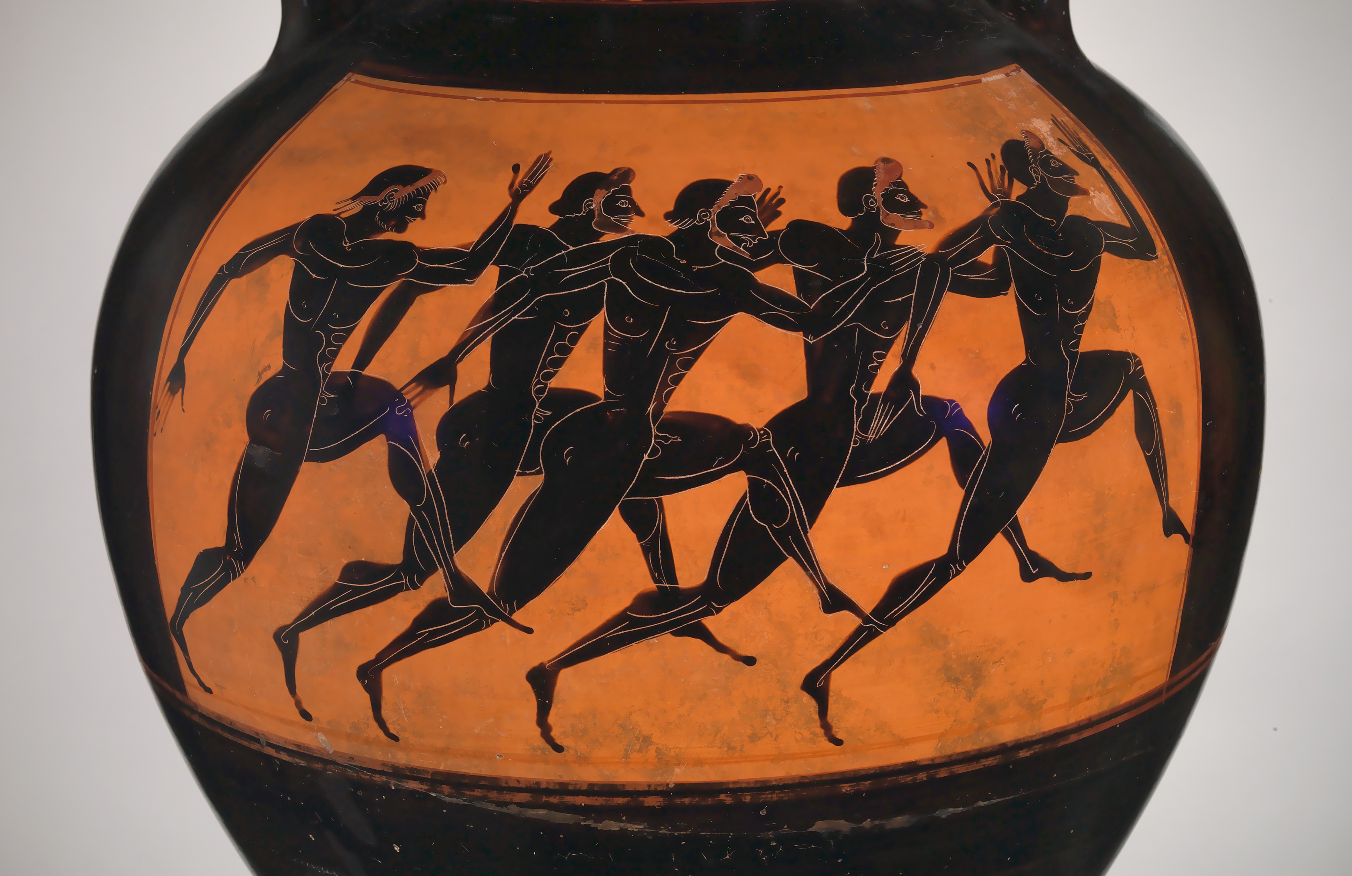 Close up of a vase featuring marathon runners 