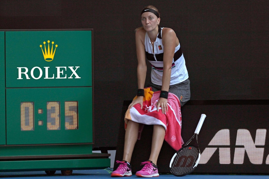 Petra Kvitova sitting down waiting for the Rod Laver Arena roof to be closed.