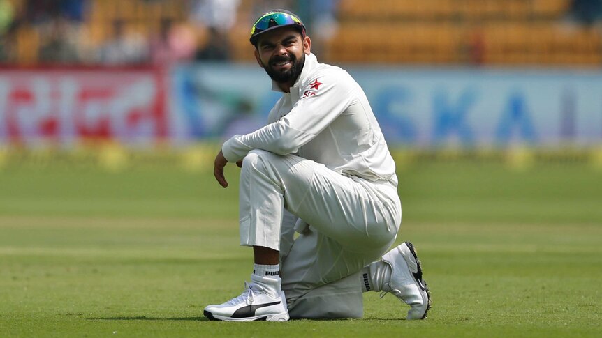 India's captain Virat Kohli reacts to a missed catch against Australia in second Test at Bangalore.