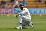 India's captain Virat Kohli reacts to a missed catch against Australia in second Test at Bangalore.