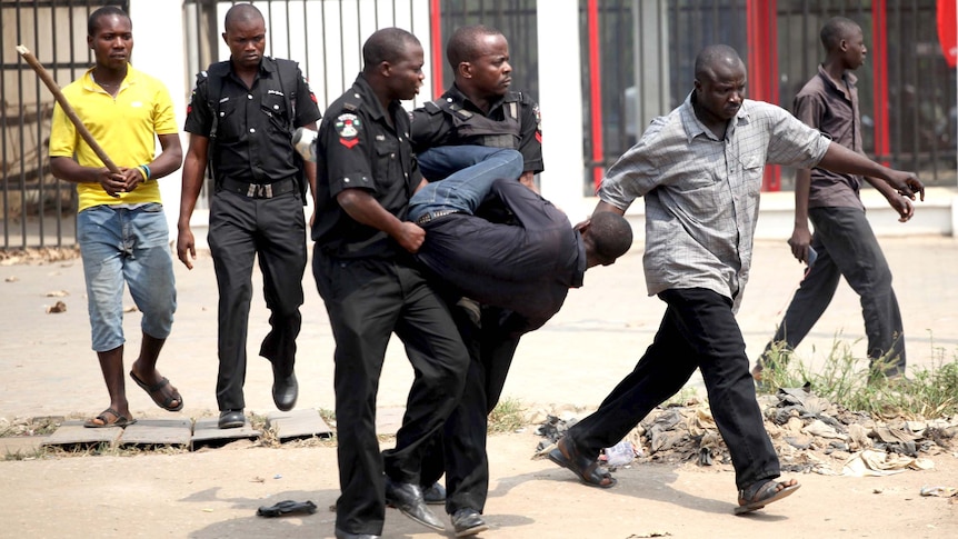 A man is arrested for looting on the fourth day of a nationwide strike in Nigeria.