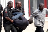 A man is arrested by the police for looting on the fourth day of the strike