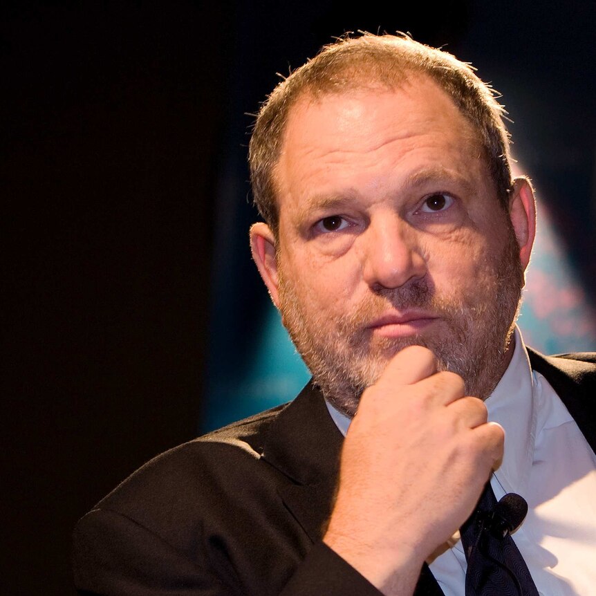 Harvey Weinstein rests his hand on his chin while speaking at an event in Abu Dhabi