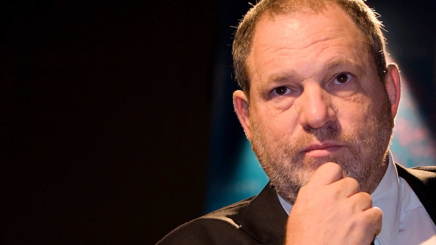 Harvey Weinstein rests his hand on his chin while speaking at an event in Abu Dhabi