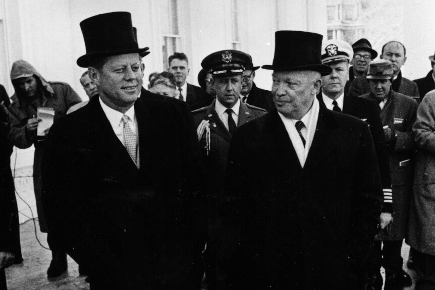 John F Kennedy at his inauguration with the outgoing president, Dwight D Eisenhower.