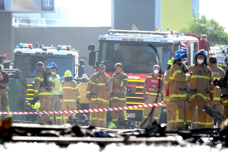 Emergency services personnel are seen at the scene of a plane crash in Essedon.