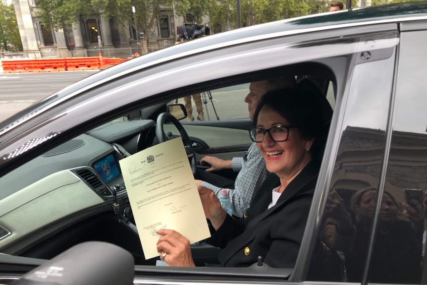 Smiling Vickie Chapman in a car.