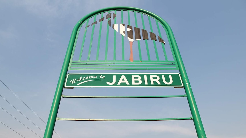 A low angle photo of the Jabiru sign at the entrance to the town.