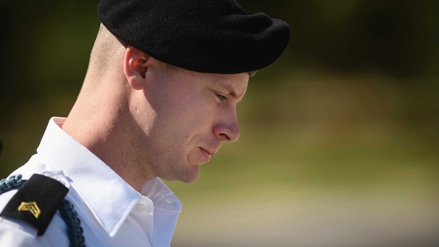 A shot of Bowe Bergdahl's head and shoulders. His head is downcast and he is looking to the ground