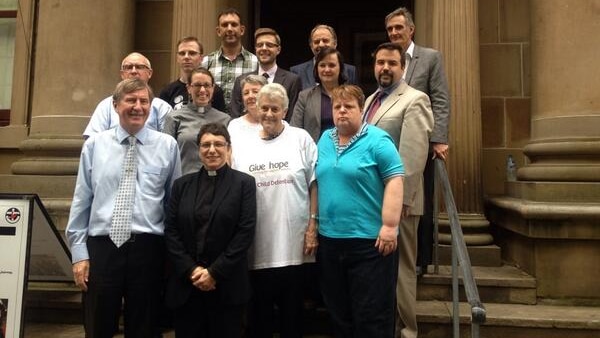 Uniting Justice national director Elenie Poulos (front) and Sydney parishioners.